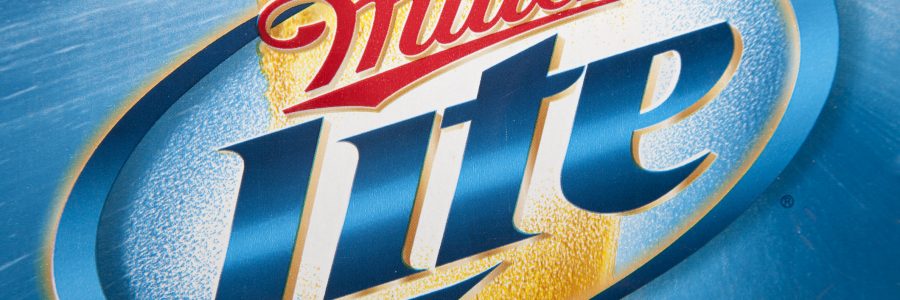 Nashville, Tennessee, USA - December, 23rd 2011: The printed blue and gold logo of the Miller Lite American beer, printed on the side of a Miller Lite beer box taken in Nashville TN.